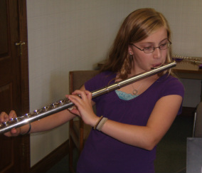 Camper playing an alto flute